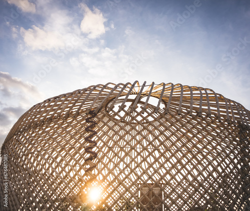 The frame of the yurt is on top of the dome, the wooden poles of the yurt are intertwined and connected at the top of the shanyrak