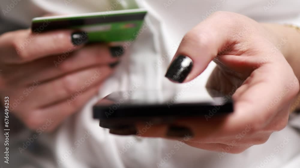 Online shopping. A woman makes an order from a smartphone. Online shopping. A woman makes an order from a smartphone.