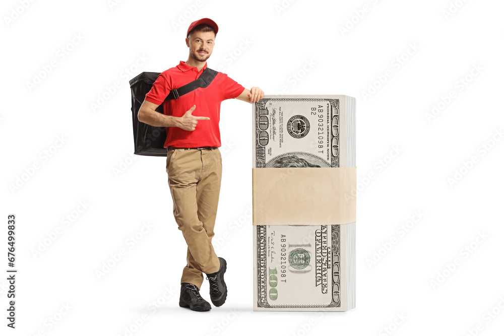 Delivery man leaning on a stack of money and pointing Delivery man leaning on a stack of money and pointing