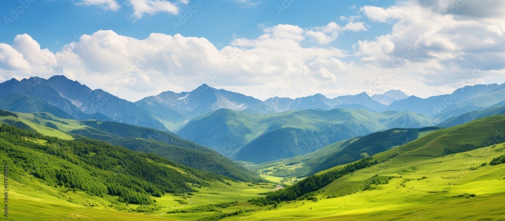 Fototapeta premium During the summer I traveled to a picturesque mountain destination with a breathtaking landscape adorned with lush green grass surrounded by towering mountains covered in autumnal hues all u