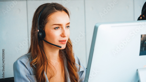 Business people wearing headset working in office to support remote customer or colleague. Call center, telemarketing, customer support agent provide service on telephone video conference call. Jivy photo