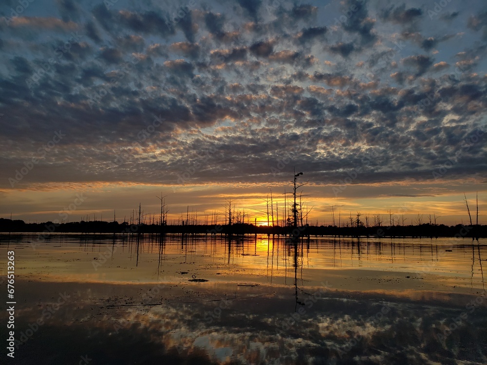 A beautiful sunset over looking the Louisiana bayou. A beautiful sunset over looking the Louisiana bayou.