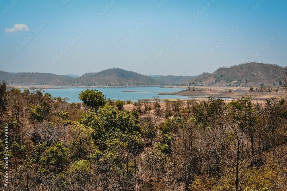 Mandan Karjan River with mountains and a blue sky in the background, India Mandan Karjan River with mountains and a blue sky in the background, India