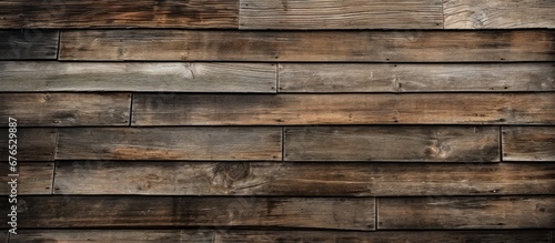 The background of the old wooden architecture showcased a beautiful pattern of weathered rectangular timber highlighting the craftsmanship of traditional carpentry and the durability of hard photo