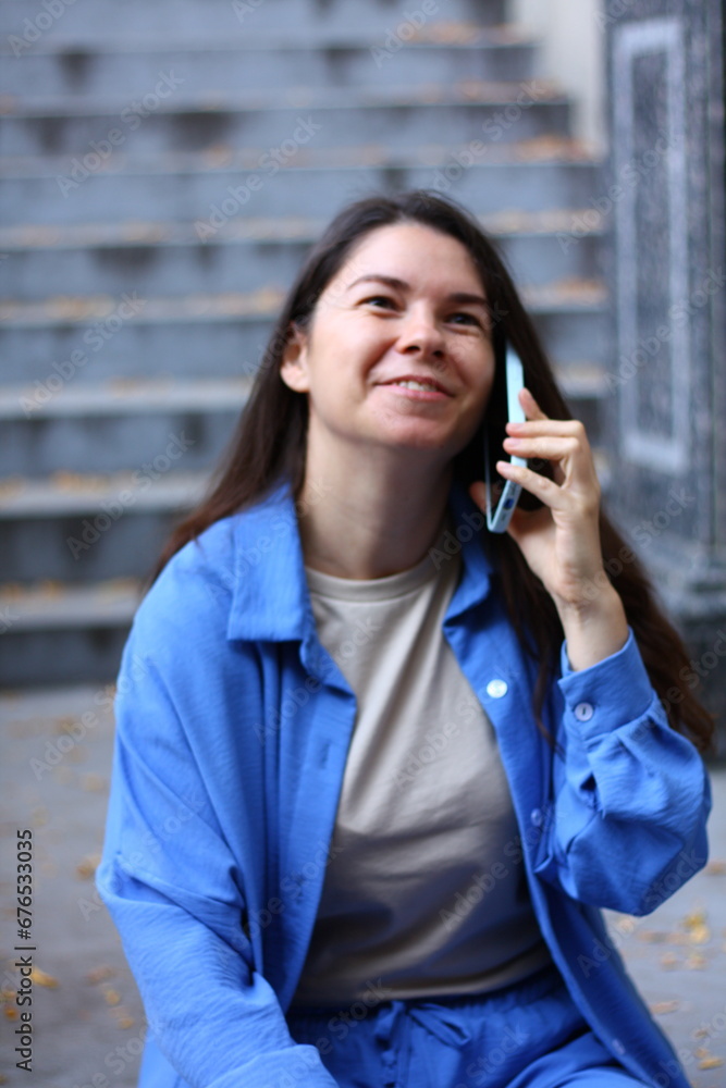 woman is talking on the phone and laughing woman is talking on the phone and laughing