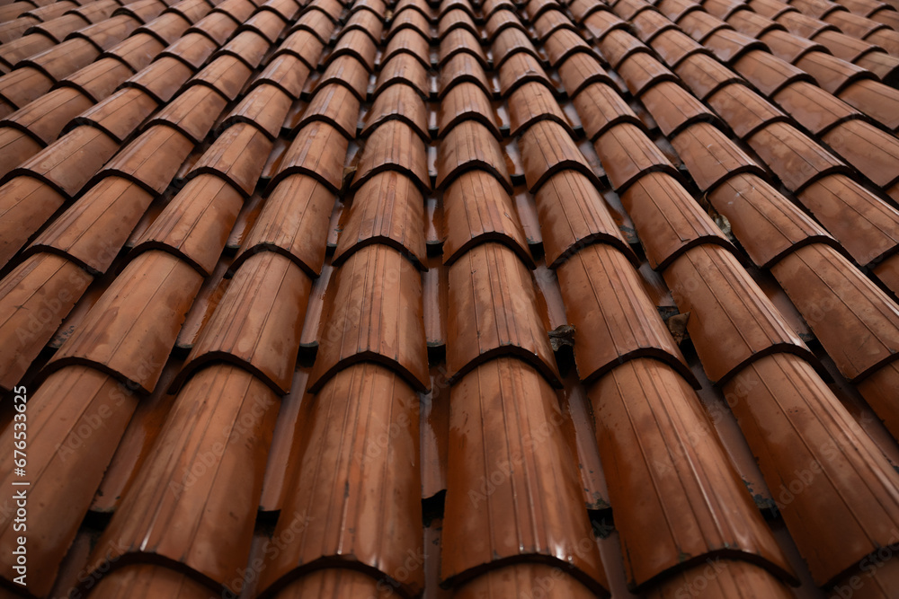 deep orange terracotta roof tile texture on a rainy day in Europe deep orange terracotta roof tile texture on a rainy day in Europe