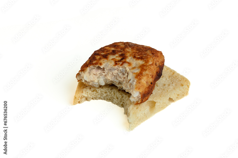 cutlet on a piece of bread, bitten off 1 cutlet on a piece of bread, bitten off 1