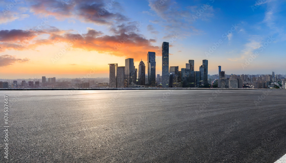 panoramic skyline and modern commercial buildings with empty road asphalt road and cityscape at sunrise
