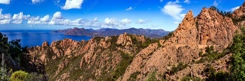 Fototapeta premium Nature of Corsica, France. Amazing red rocks of Calanques de Piana. famous route and travel destination in west coast of the island in gulf of Porto