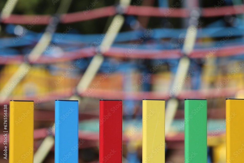 Colorful markers on the blurry background of the playground