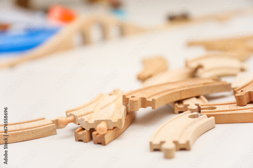 Children's colorful toys, tiny legs, and building blocks scattered on the floor, a playful scene of early childhood development Children's colorful toys, tiny legs, and building blocks scattered on the floor, a playful scene of early childhood development