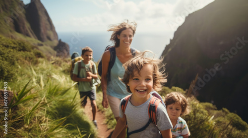 Family with small children hiking outdoors in summer nature, walking in Madeira mountains