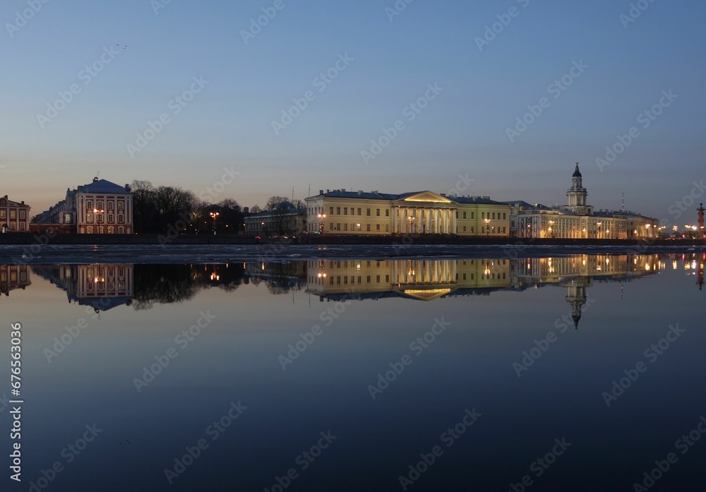 Reflection of famous buildings in Saint Petersburg on the River Neva in the evening