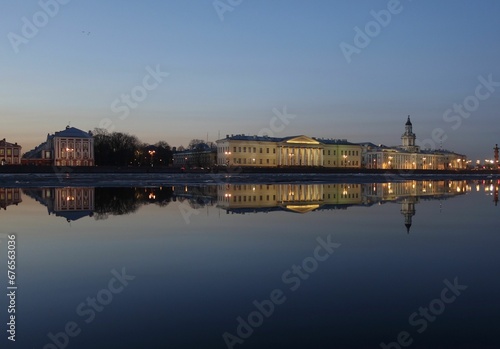 Reflection of famous buildings in Saint Petersburg on the River Neva in the evening © Wirestock