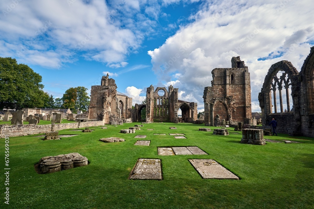 Fototapeta premium Elgin Cathedral with a cloudy blue sky in the background, Elgin, Scotland