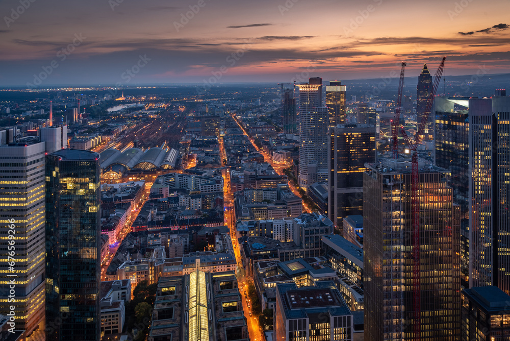 Fototapeta premium Evening aerial view of the centre of Frankfurt am Main with its skyscrapers and streets with lights
