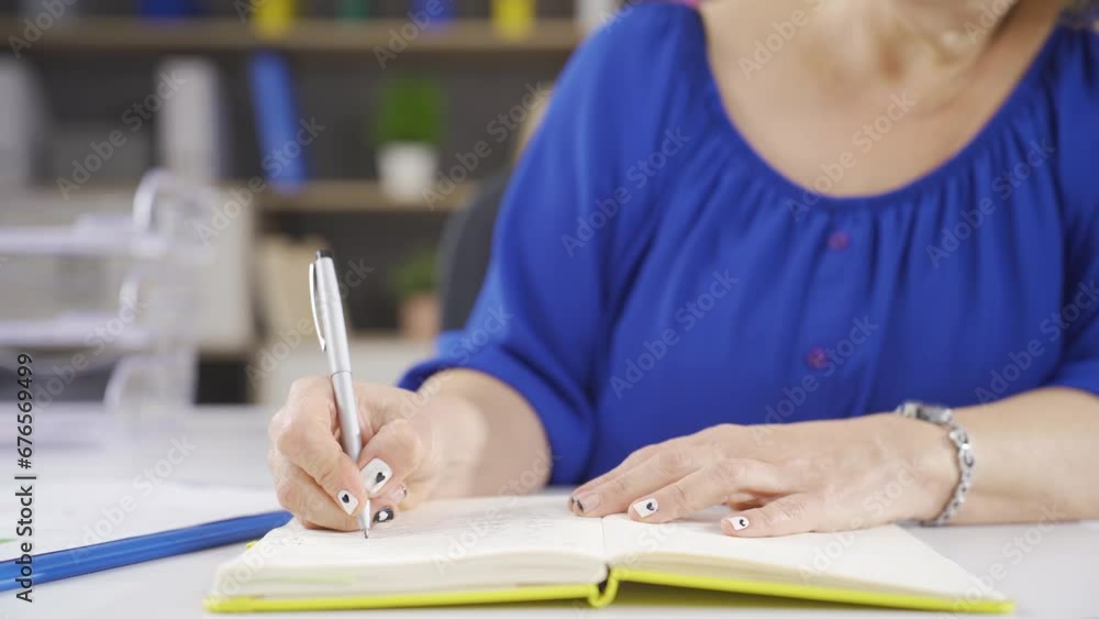 Businesswoman holding notepad and pen. Businesswoman holding notepad and pen.