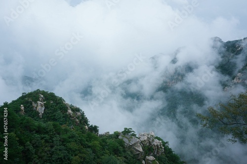 Beautiful view of clouds over the mountains. © Wirestock