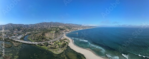 Aerial panoramic shot of the beach with the waves crashing on the shore, Los angeles, Malibu