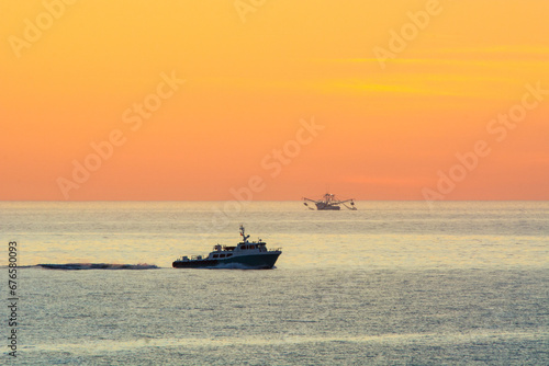 fishing boats at sunrise © ChuckS