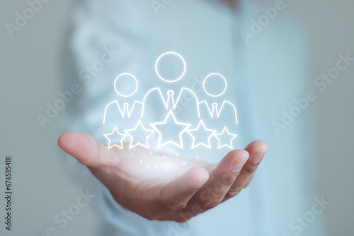 Businessman hand show business client retention icon, people membership group with 5 star. Customer experience concept, best excellent service rating for satisfaction. Customer Relationship Management photo