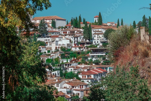 Aerial view of the city of Granada and its beautiful architecture seen on a sunny day © Wirestock