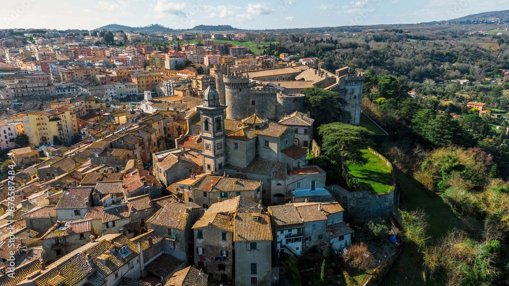 Drone shot of the Orsini-Odescalchi castle and other buildings In Bracciano, Lazio, Italy