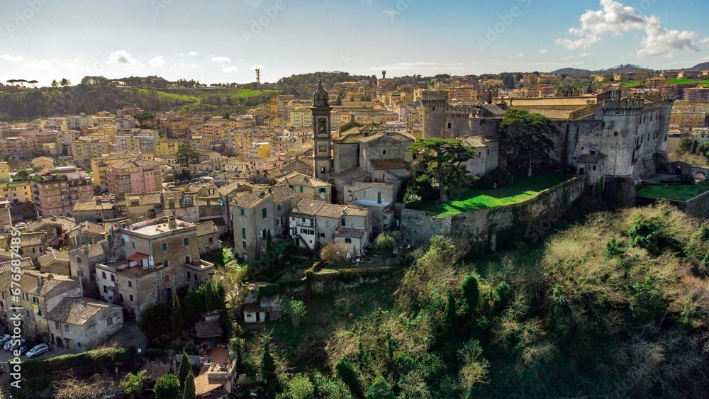 Drone shot of the Orsini-Odescalchi castle and other buildings In Bracciano, Lazio, Italy