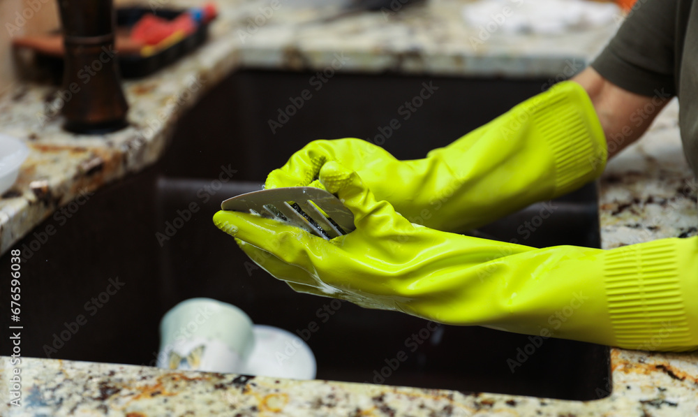 handwashing dishes, symbolizing equality and shared responsibilities