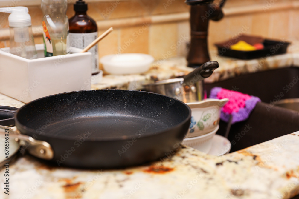 handwashing dishes, symbolizing equality and shared responsibilities