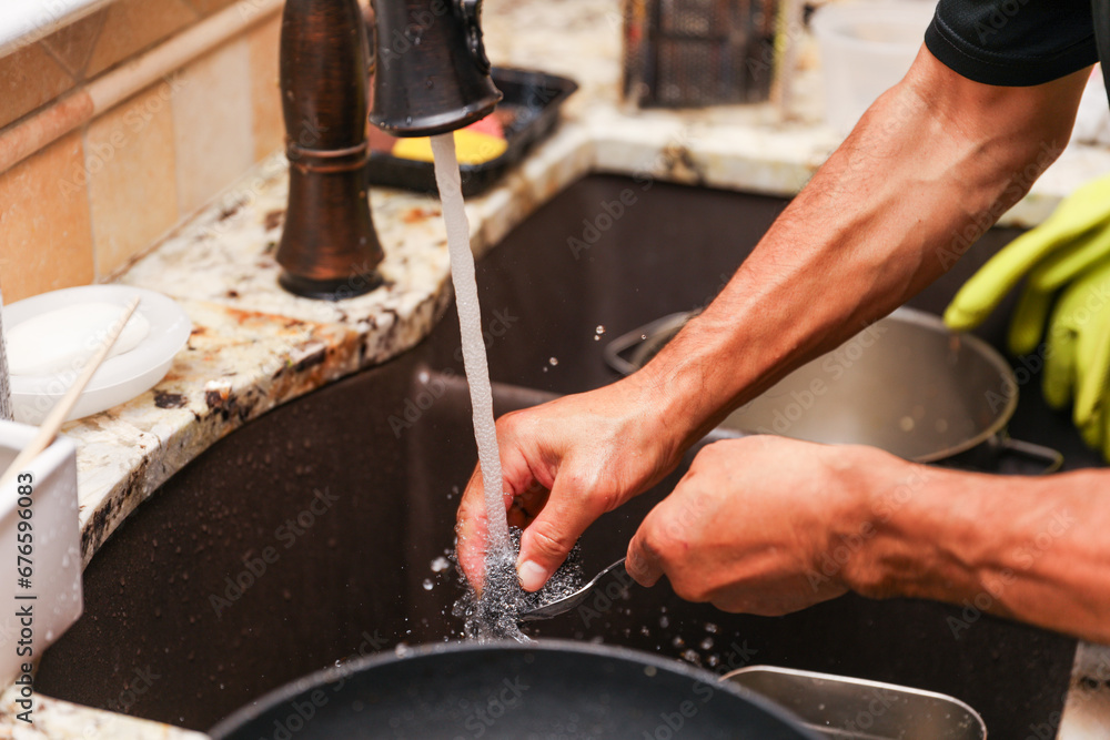 handwashing dishes, symbolizing equality and shared responsibilities
