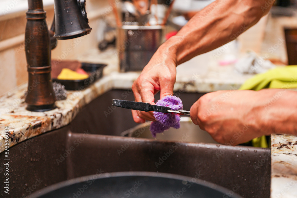 handwashing dishes, symbolizing equality and shared responsibilities