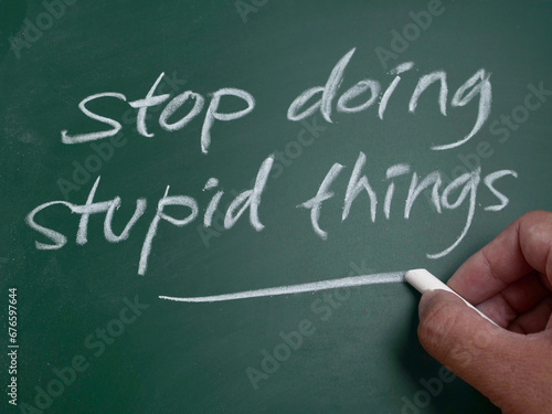 Vászonkép Stop doing stupid things, word text written on chalkboard, motivational inspirat