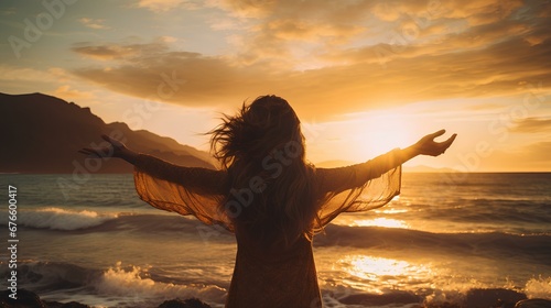 Woman with arms outstretched facing the ocean. expression of freedom, hope, passion, and unity with nature. generative AI photo