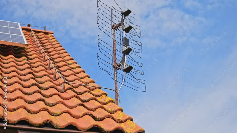 Television Antenna Installed on House Roof Television Antenna Installed on House Roof