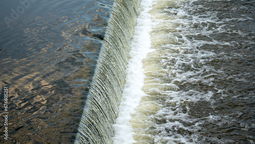 dam on a small river, water level drop