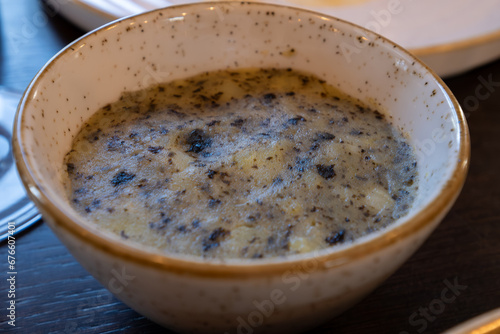 Side dish in restaurant in France, farm mashed potatoes cooked with green dried nori seaweed