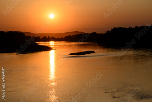 View from Pont de Pouilly-sur-Loire bridge 496 km from the source and 496 km from the mouth of the Loire river near Pouilly-sur-loire, Central France ar sunset