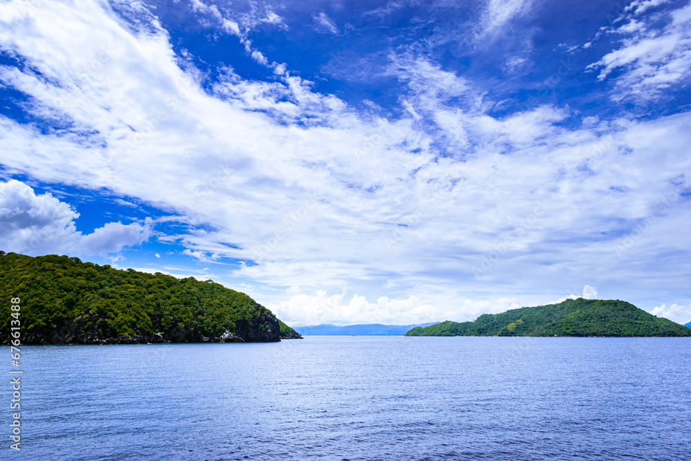 Tropical islands on a sunny, blue sky. Romblon Island, Philippines