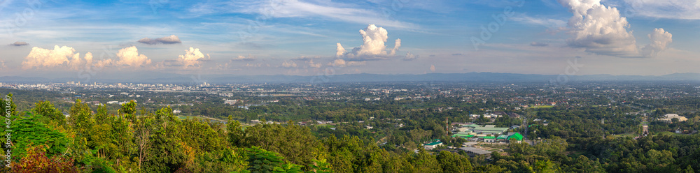 Panorama view of Chiangmai Chiang Mai city taken from Doi Suthep Mountains. Lovely views of the Old city at Sunset Sunrise lovely tropical mountains and beautiful nature in the foreground - obrazy, fototapety, plakaty 