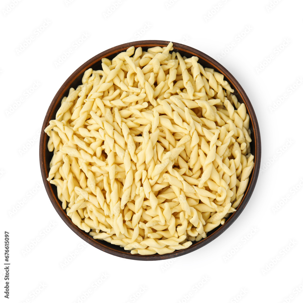 Uncooked trofie pasta in bowl isolated on white, top view Uncooked trofie pasta in bowl isolated on white, top view