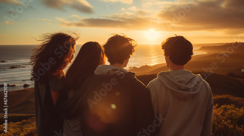 Three Teens Gazing at Sunset from the Hilltop