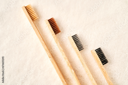 Toothbrushes on a white terry towel.