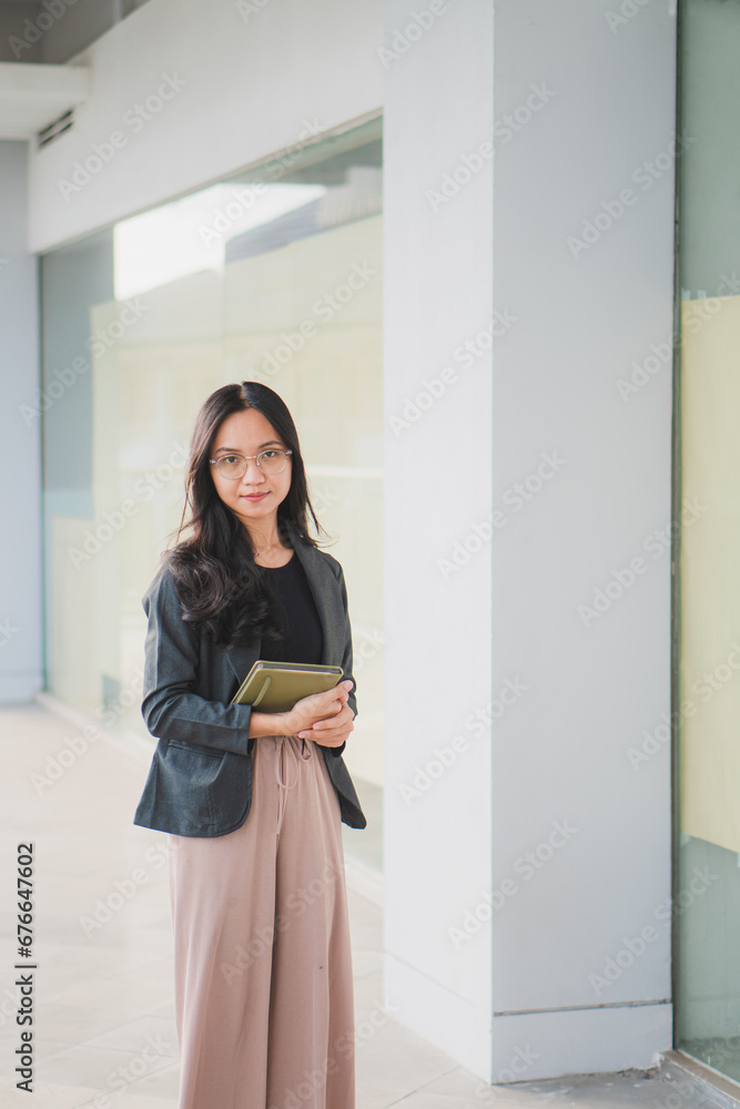 Beautiful Asian businesswoman crossed arms looking at the camera. Beautiful Asian businesswoman crossed arms looking at the camera.