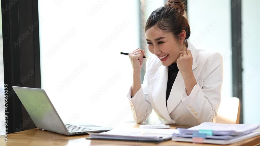 4K Video: Asian businesswoman using laptop computer and documents on table in office internet technology business analysis concept 4K Video: Asian businesswoman using laptop computer and documents on table in office internet technology business analysis concept