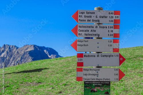 Wooden signpost on the Spinale Mount. Trentino Alto Adige, Italy