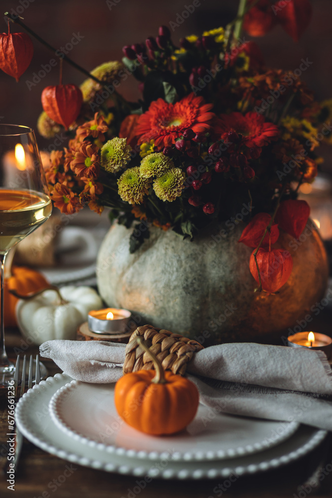 Fall composition. Orange pumpkins, flowers and candles on wooden table. Family elegant Thanksgiving or halloween dinner. Cozy autumn concept, simple handmade decoration, countryside style, wine Fall composition. Orange pumpkins, flowers and candles on wooden table. Family elegant Thanksgiving or halloween dinner. Cozy autumn concept, simple handmade decoration, countryside style, wine