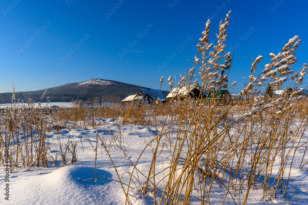 Winter snowy village in the Ural mountains.
