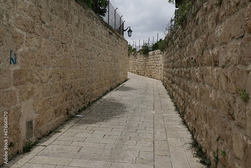 Narrow passage between two stone walls