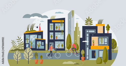 Green living and sustainable lifestyle urban community tiny person concept. Nature protection for environmental and ecological future vector illustration. City with green rooftops and lush greenery.
